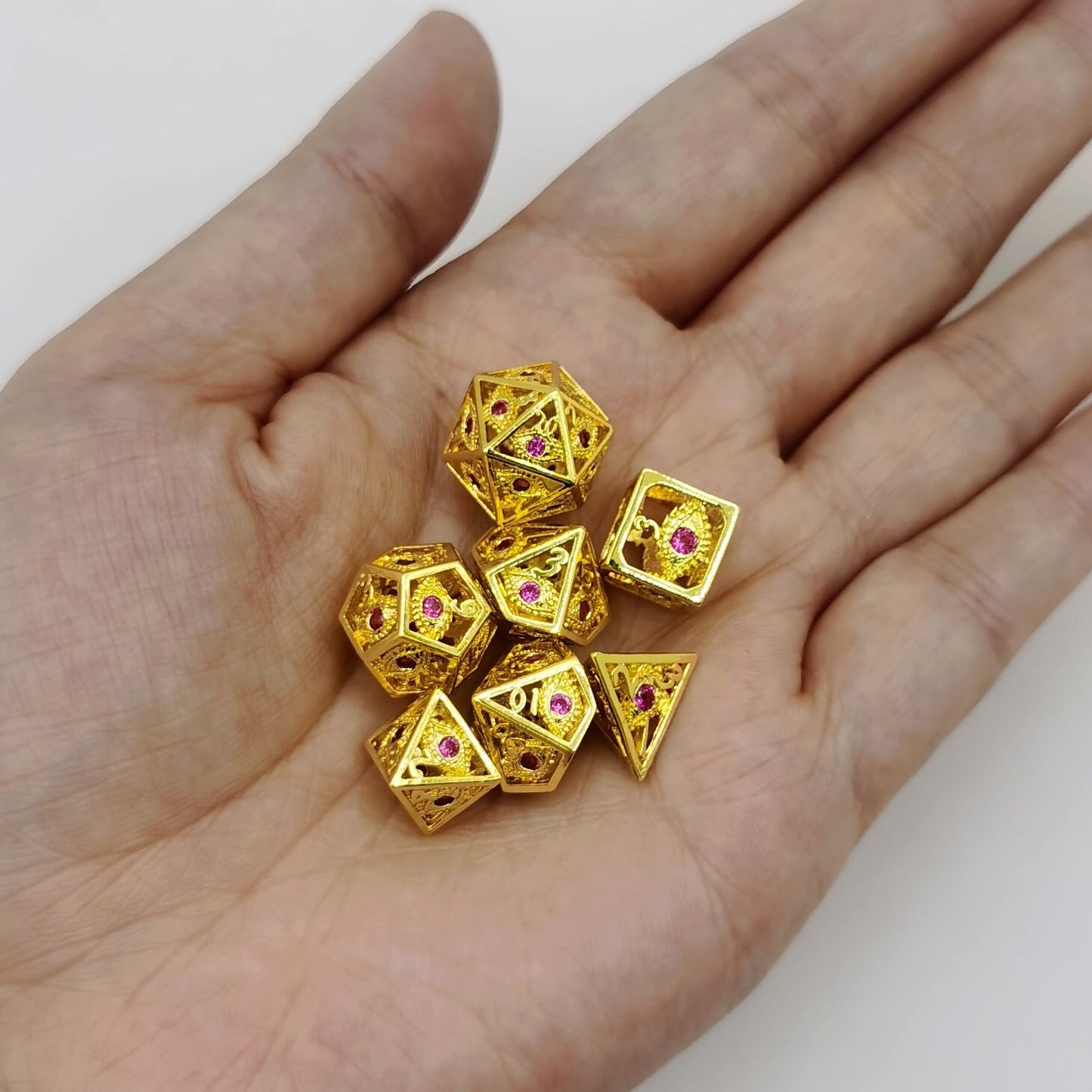 Hollow 10mm mini Dragon's Eye dice set-Shiny Gold with Red Gems