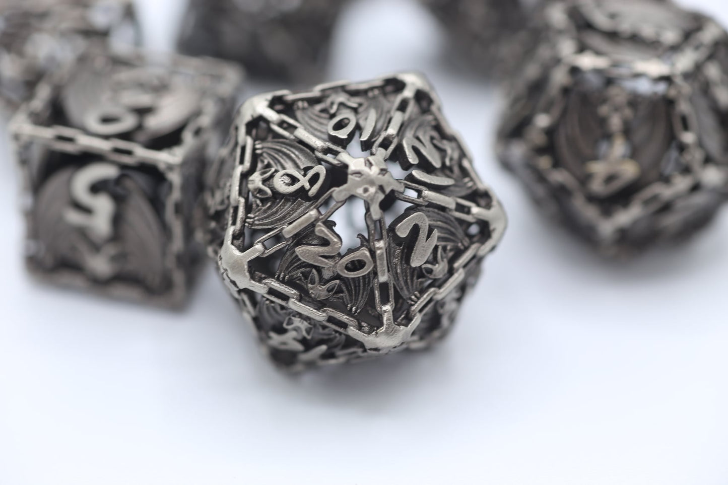 Ancient Silver Hollow Metal Bat RPG Dice Set