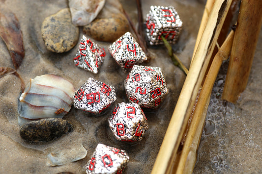 Silver with Red Pile of Skulls Solid Metal Dice Set