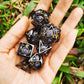 Black with Purple Gems Dragon's Eye Hollow Metal Dice set